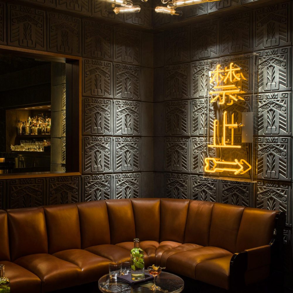 a bar and lounge with ambient lighting